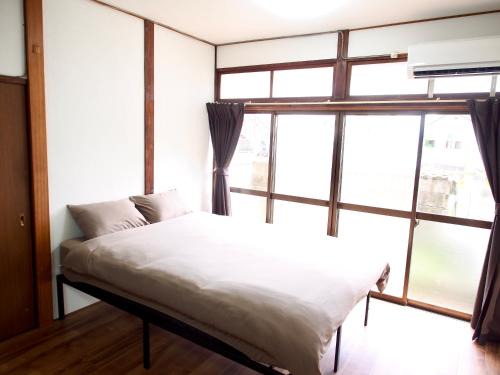 Yahatanishi House | ゲストハウスEn 折尾駅前邸