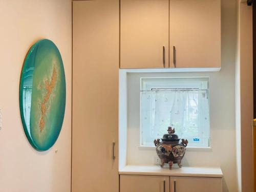 Okinawa Ski Chalet | 空港まで車で15分ビーチまで徒歩1分海沿いの閒雲斎