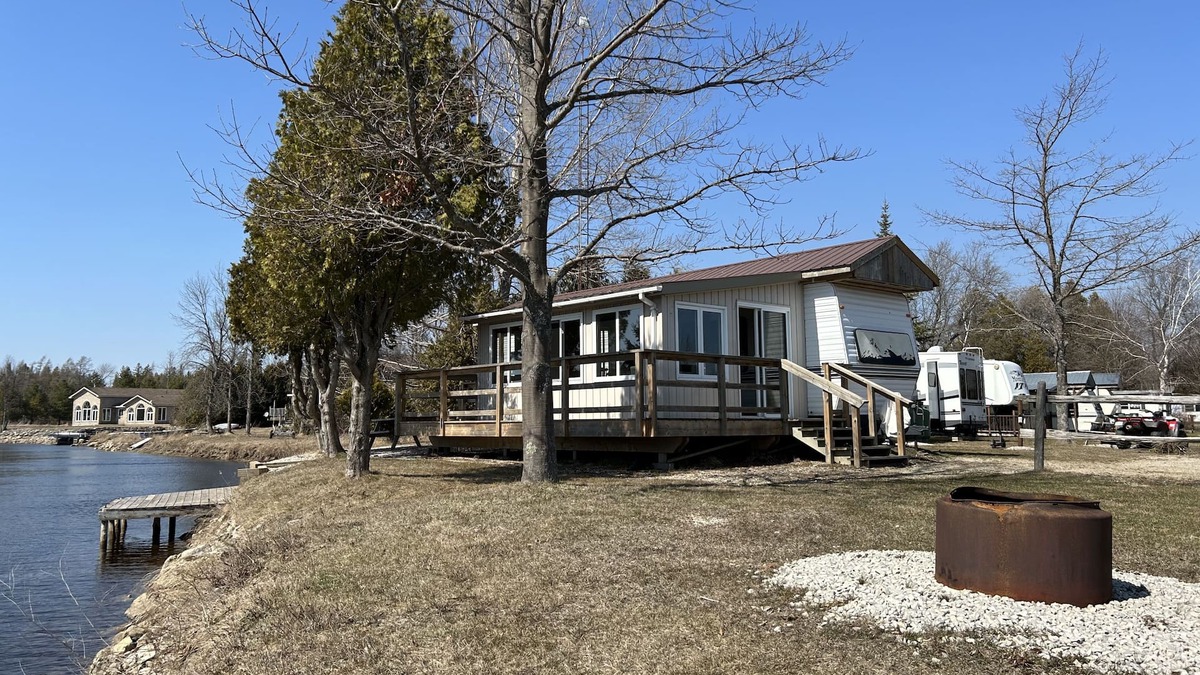 Stokes Bay RV Rental | #0 Enjoy a waterfront view from your own trailer with a deck & sunroom