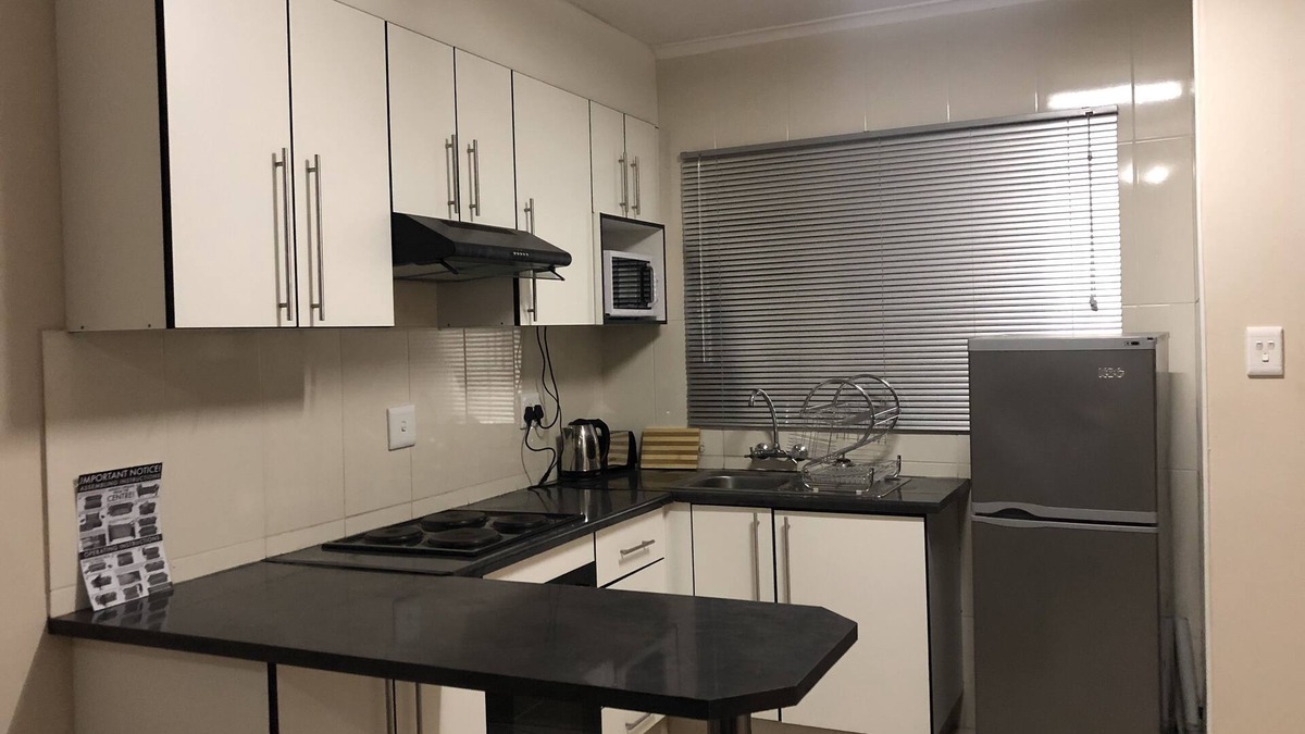 Manzini Apartment | 1 bedroom apartment, sleeps 4, 1 queen bed and double sleeper couch, bathtub