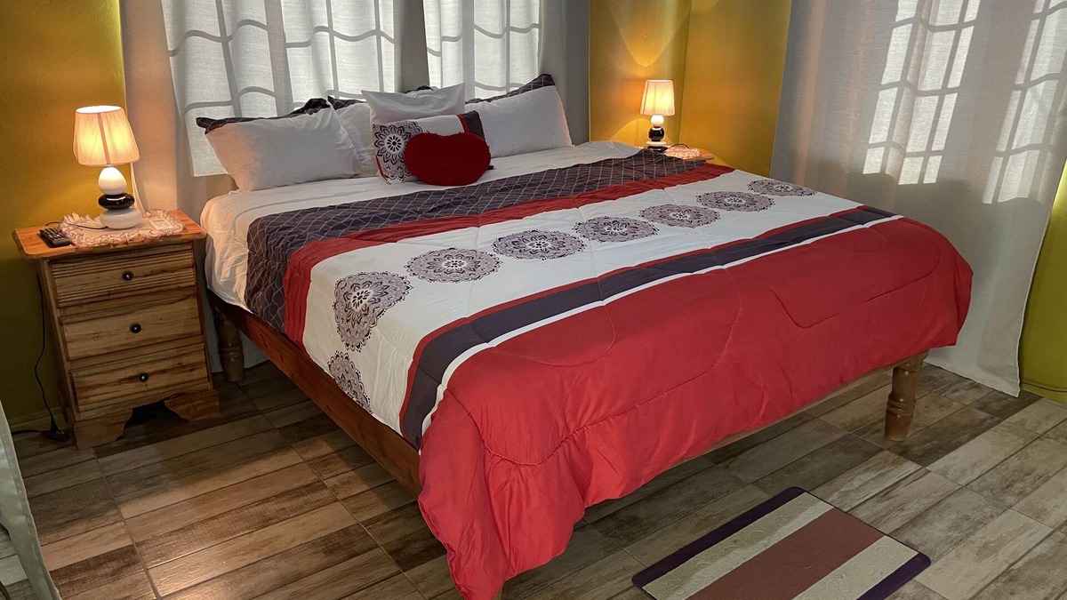 Negril House | 1 King bed, cable tv , wifi mini fridge stocked with welcome beer