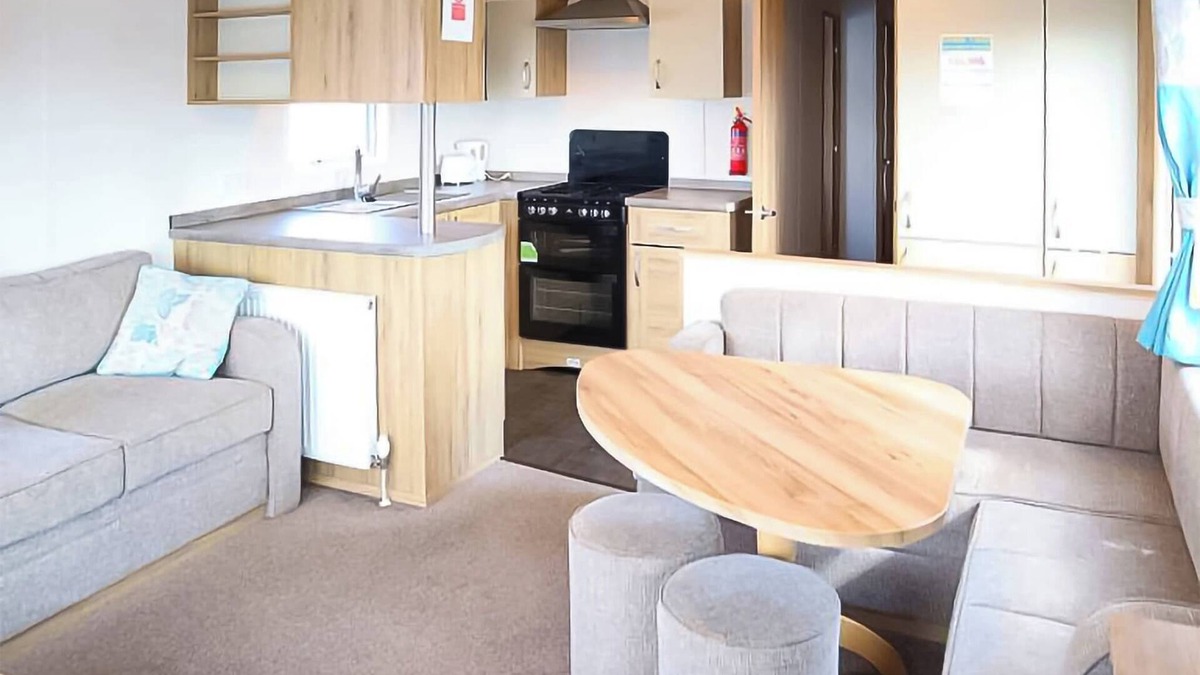 Chapel Saint Leonards House | 12ft-wide stylish and comfortable caravan with one double and two twin.