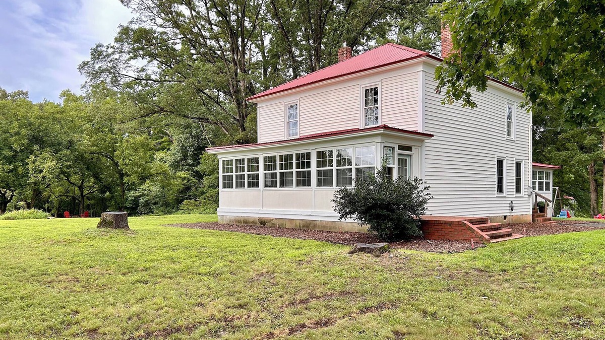 Clarksville House | 1920s farmhouse with a water view, and 6 miles to downtown Clarksville.