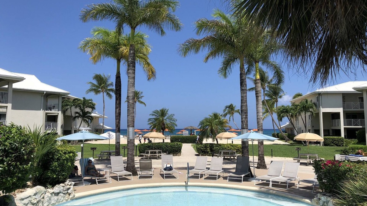 Seven Mile Beach Condo | 1st Floor POOLSIDE/OCEAN VIEW Protected Cove & Beach-Most 10 Star Reviews on 7MB