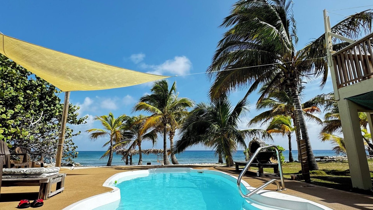 West End House | 2-bd sandy beachfront apt w/pool, cabana, hammocks, sunsets! a tropical dream!