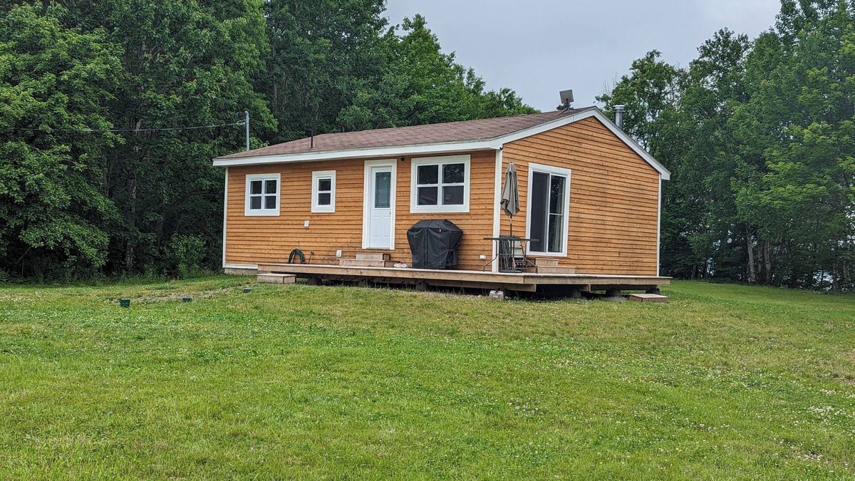 Inverness County Cottage | 2-Bedroom Cottage On Lake Ainlsie Private Beach, Enjoy Fishing & Swimming.