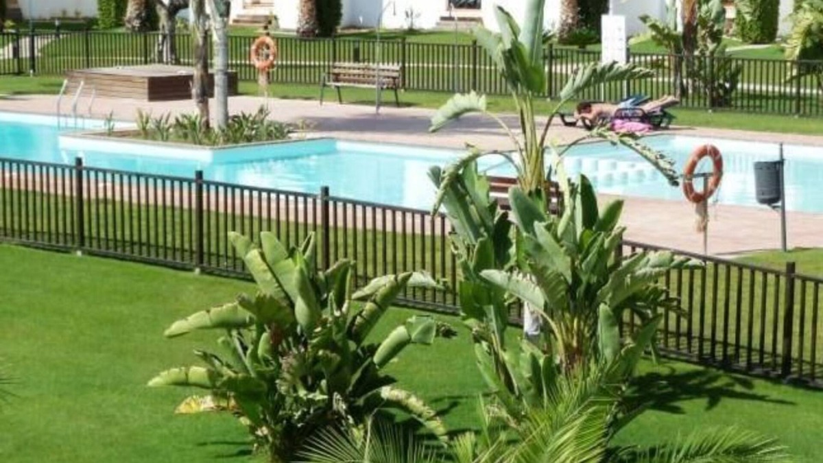 Roldan Apartment | 2 Bedroom (sleeps 4/5) ground-floor apartment backing onto grass area & pool