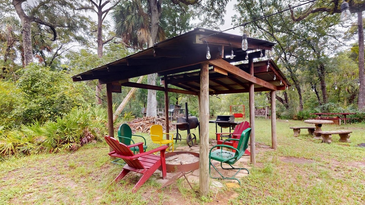 Bronson Cabin | 2 riverfront cabins with large yard, grill, firepit, canoe, & private W/D