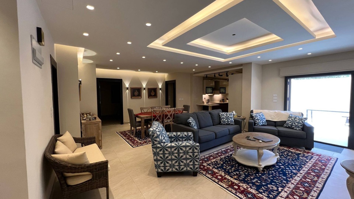 Sahab Apartment | 3 bed room apartment with modern kitchen indoor and out door seating area .