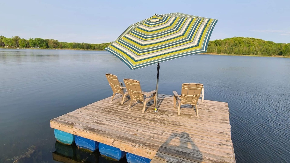 Delton House | 3 bedroom home on a peaceful private no wake lake. With kayaks and floating deck