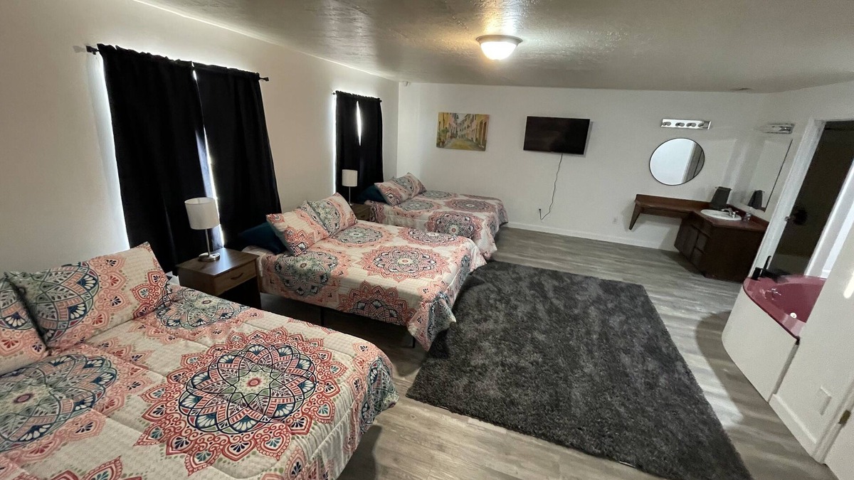Emery County House | 3 queen beds with Jacuzzi tub and private bath, TV and walk-in closet & Mt. View
