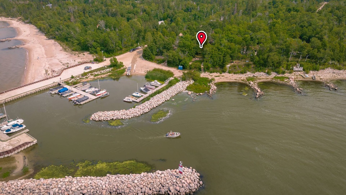 Beaconia House | 3BR Harbor Front House with Fire Pit Canoe, Hammock & Bikes near Grand Beach.