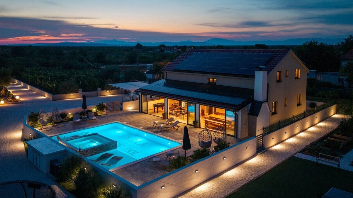 Oklaj Villa | 4 en-suite bedrooms, two finnish saunas, heated pool with Whirlpool, deck chairs in shallow area, natural surroundings