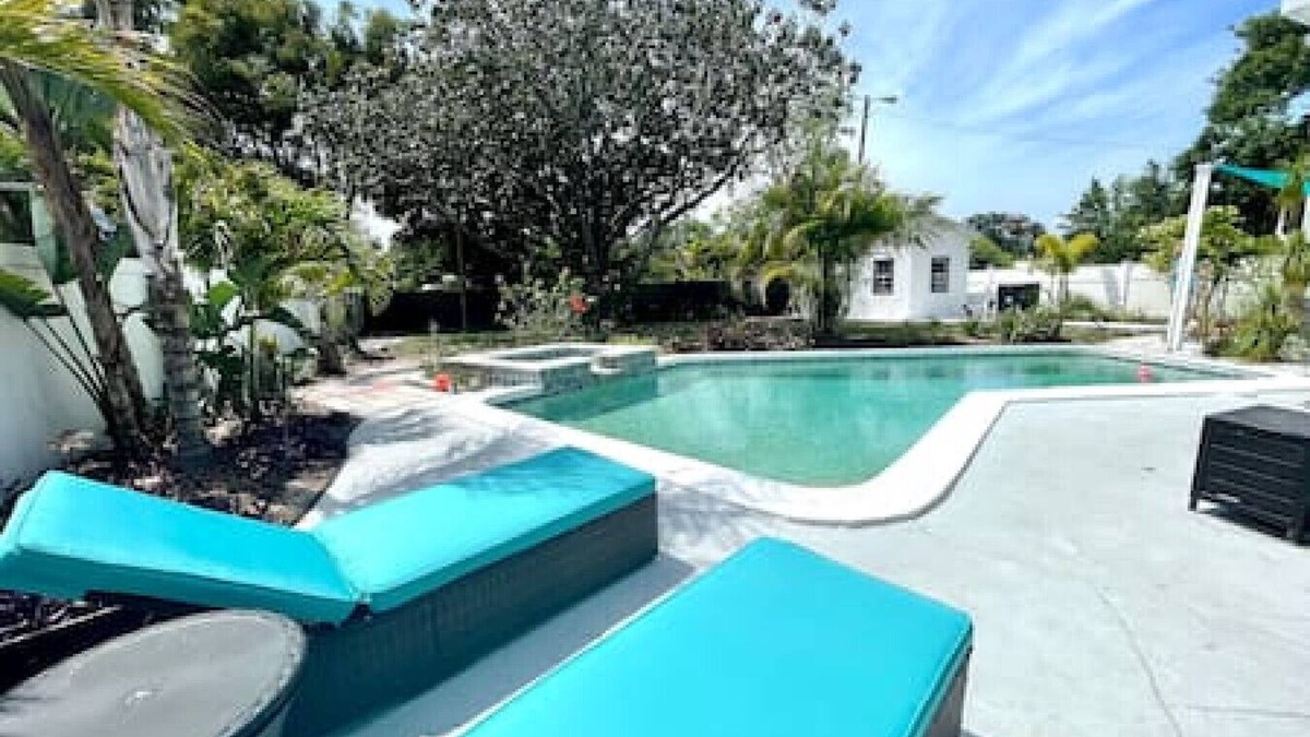 Sun Bay South House | 5805 S Hubert Ave · Charming Tropical Pool Retreat w Hot Tub