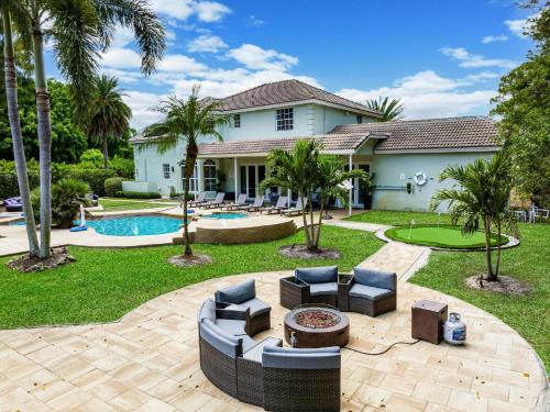 Hillsboro Pines Villa | 8BR Entertainers Estate w Pool Games Theater