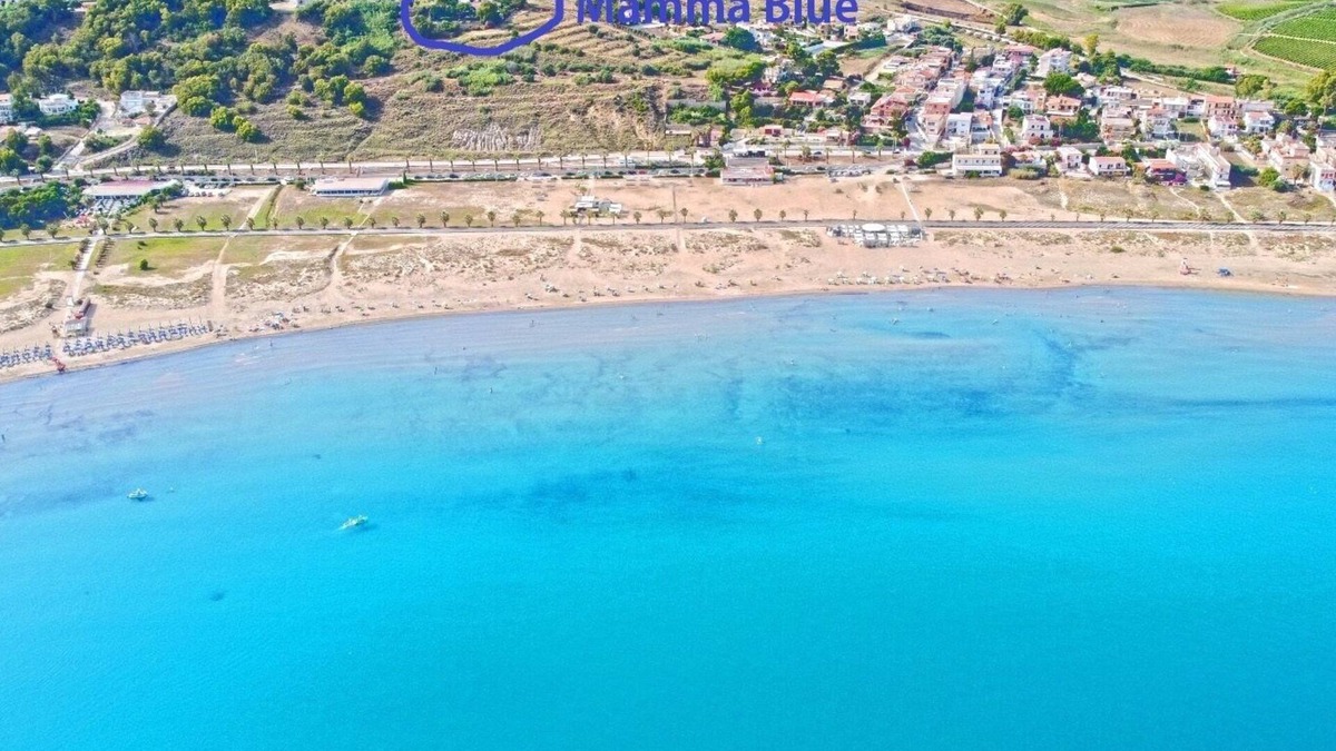 Porto Palo Villa | A balcony on the beach, pool, lush park