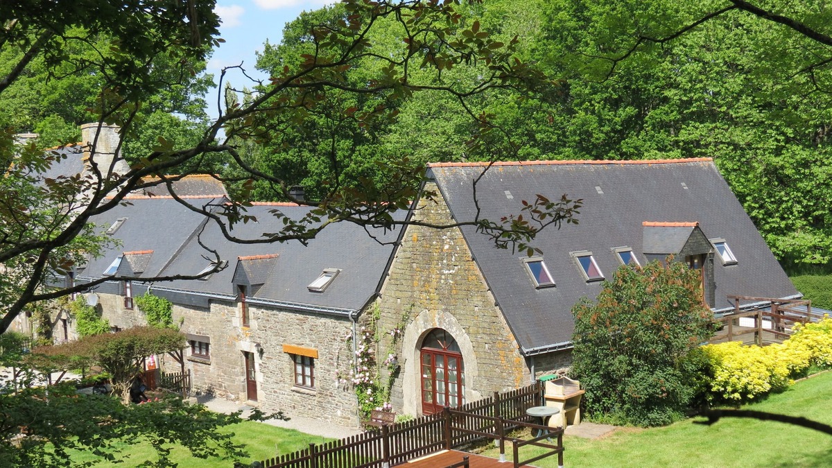 Plumeliau House | A Beautifully Restored Coach House With Heated Pool in large garden
