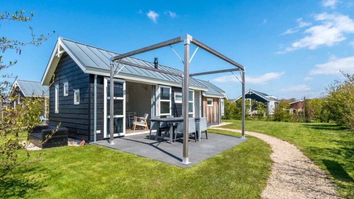 Westenschouwen House | A glass of wine by the gas stove, a board game at the round dining table or a captivating book in th