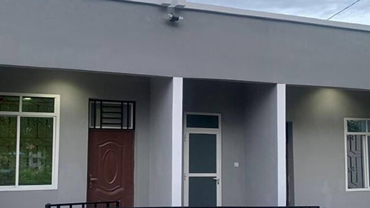 Mbezi House | A Large Bedroomm With Next to the Seating Room