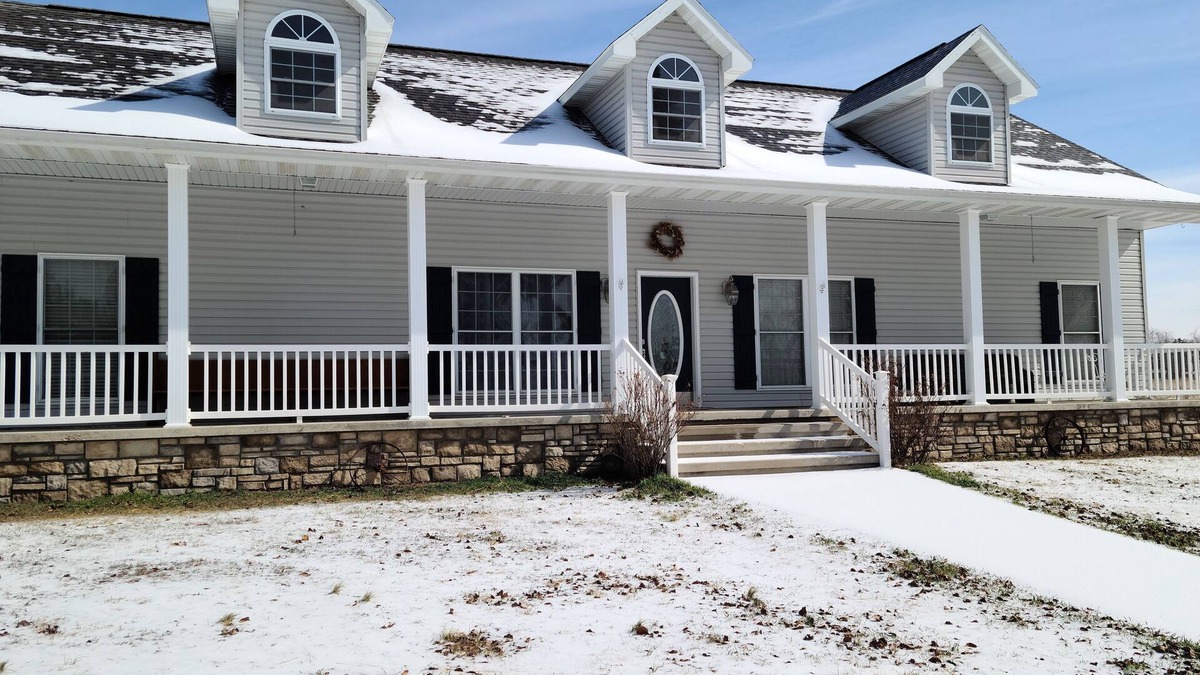 Pomona House | A large country home with scenic views of a working cattle farm & rural locale.
