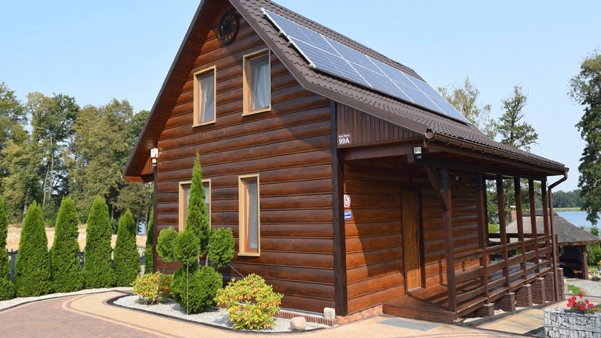Lubna House | A luxury home on the shore of the lake. Living room with fireplace, 2 bedrooms.