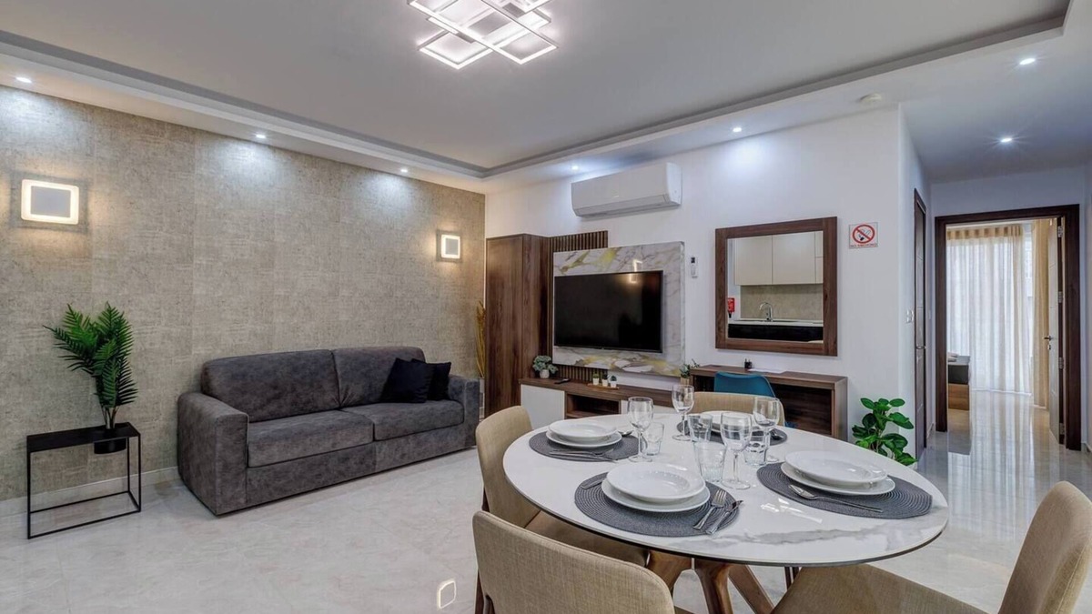 Bugibba Apartment | A modern apartment block in the heart of Bugibba. All one-bedroom flats, stylishly finished and fully equipped with comfort, ideally located close to shops, services, and all amenities.