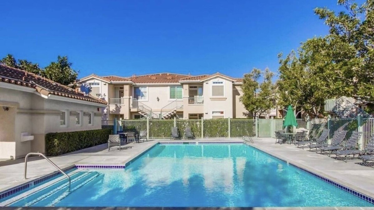 Sabre Springs Condo | A room wt a queen bed and room with 2 twin beds; an attached,interior bathroom.