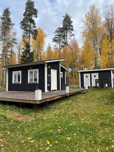 Grythyttan House | A simple stuga on a lake incinerating toilet in a separate building next to the cabin Water for drinking and washing hands dishes comes from two containers that attach to a faucet through a simple electric pump OBS no shower on site