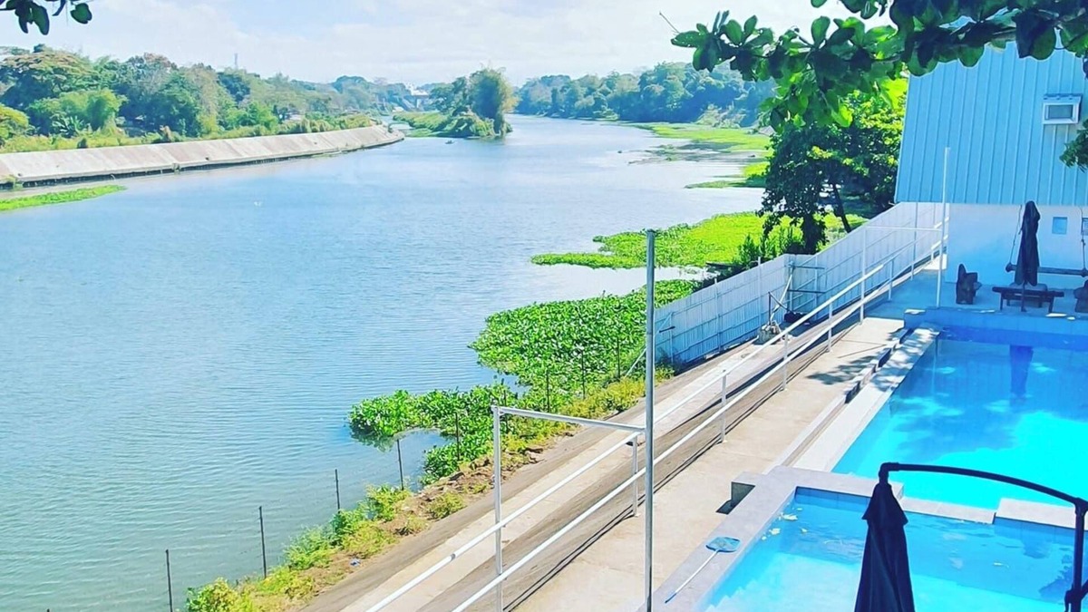 Malolos City House | A slice of paradise with a beautiful river view and infinity pool.