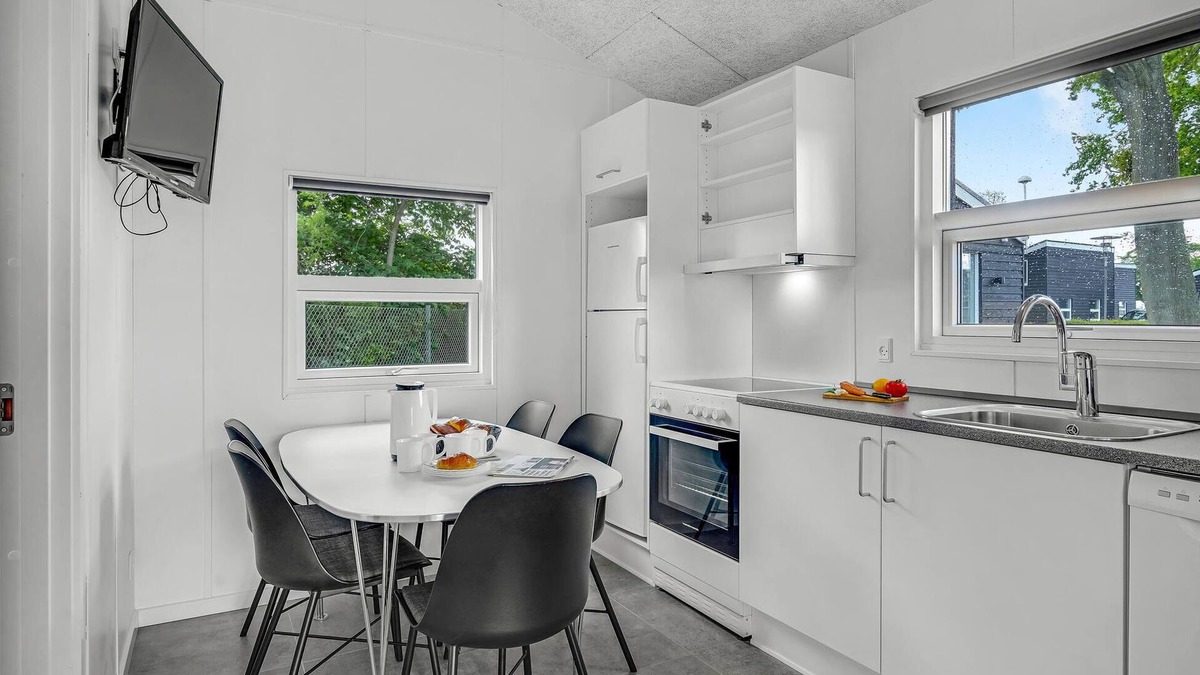 Assens House | A small cottage awaits you here, located on a campsite with a playground.