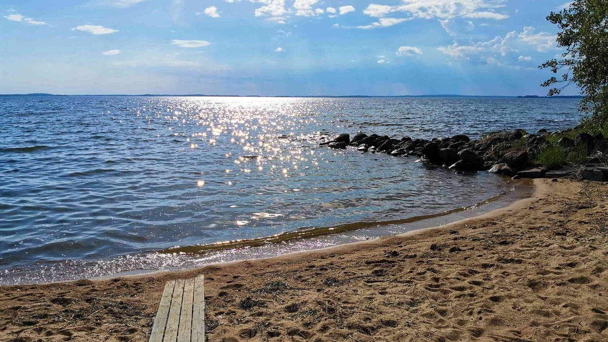 Kesaelahti Villa | A sunny, vintage villa with private sandy beach and breathtaking lake views