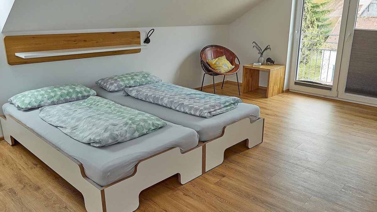 Waggershausen Apartment | Above the rooftops - cozy attic apartment with mountain view and mini balcony.