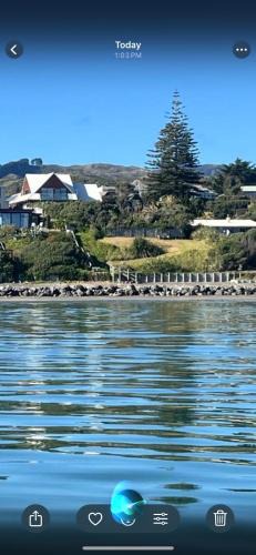 Raumati South House | Absolute Beachfront Holiday Home With Private Beach Access To Swim Beach Spectacular Sunsets