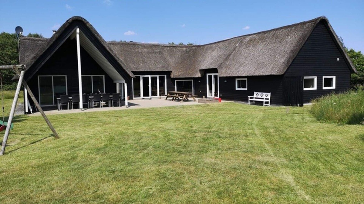 Toftum House | Activity house under thatch with pool, whirlpool, sauna and activity room