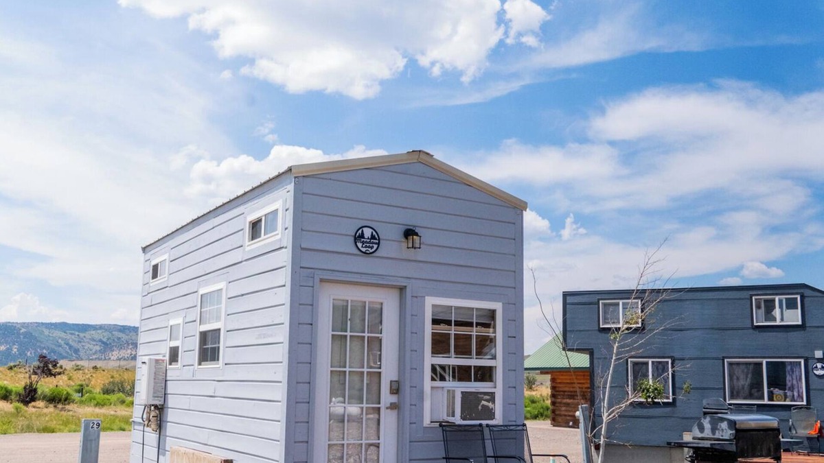 Meeker House | Adorable Tiny Home with two lofts. Both are accessible by ladder. One has a Queen mattress and the other has a Twin mattress. Home also contains a folding Full futon on main level. Sleeps: 4