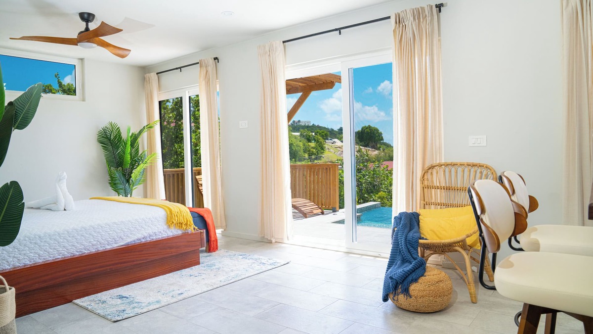 Osbourn Cottage | Affordable luxury, with runway views and tropical breeze.