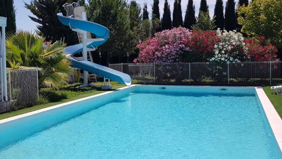 Milhaud Ski Chalet | Air-conditioned 2-bedroom chalet with pool, slide, garden, games.