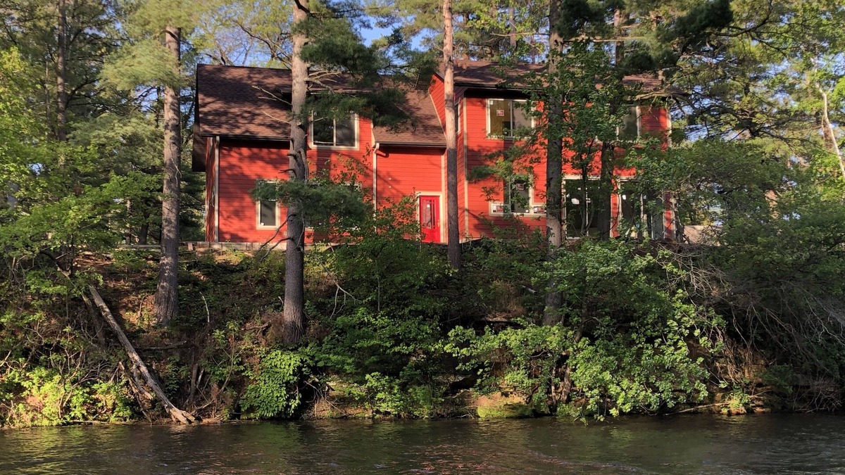 Tainter Lake House | Amazing River House with covered patio! Sleeps 10-14. Kayaks,Fireplace,Games.