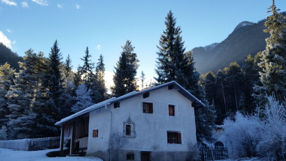 Sent House | Ancient typical Engadine mill on a stream near the woods and walks