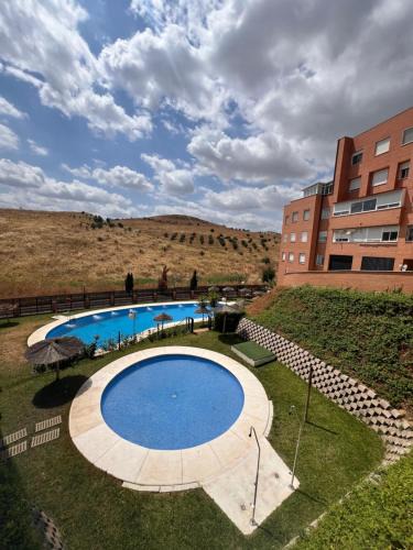 Camas Apartment | Apartamento Jardín de Atalaya