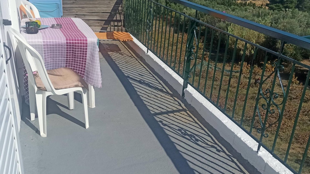 Kompi Apartment | Apartment above Peroulia beach near Koroni - taverna in front of the house
