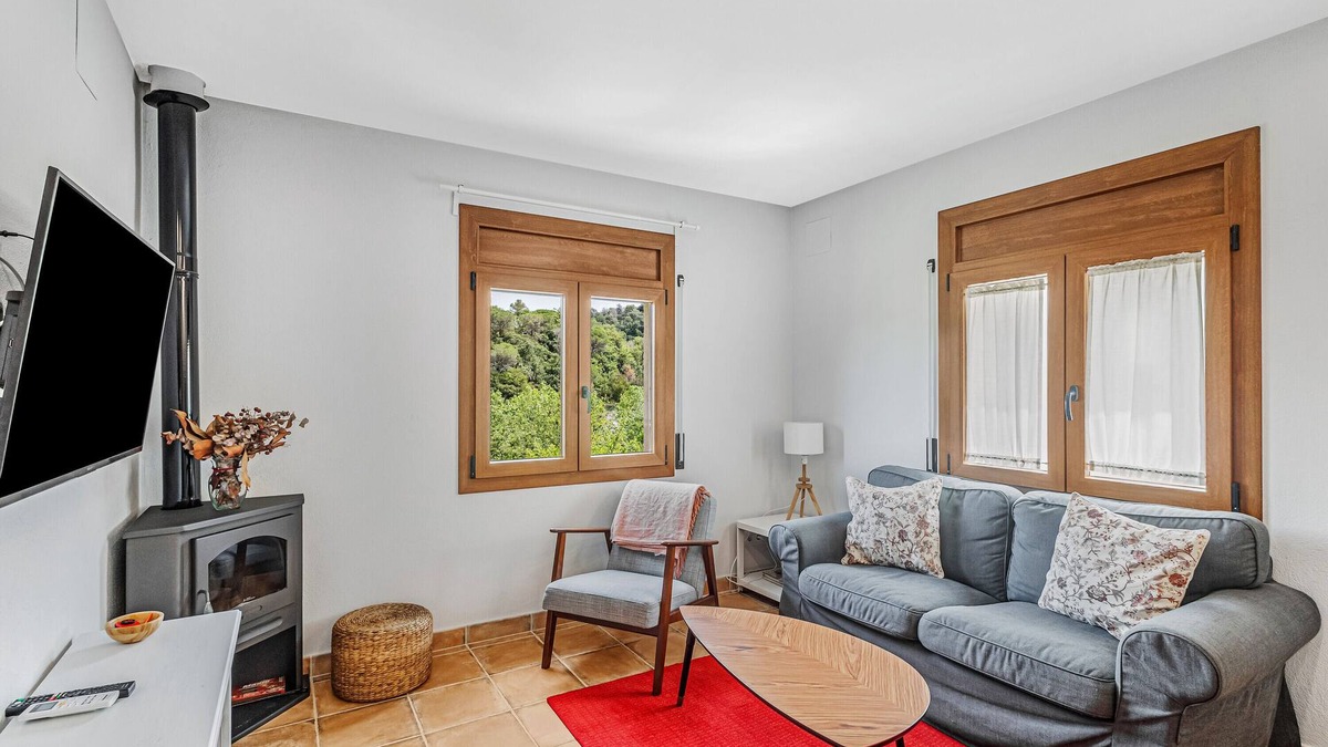 Sant Quirze Safaja Apartment | Apartment 'Cal Ton' with Mountain View, Shared Garden and Air Conditioning