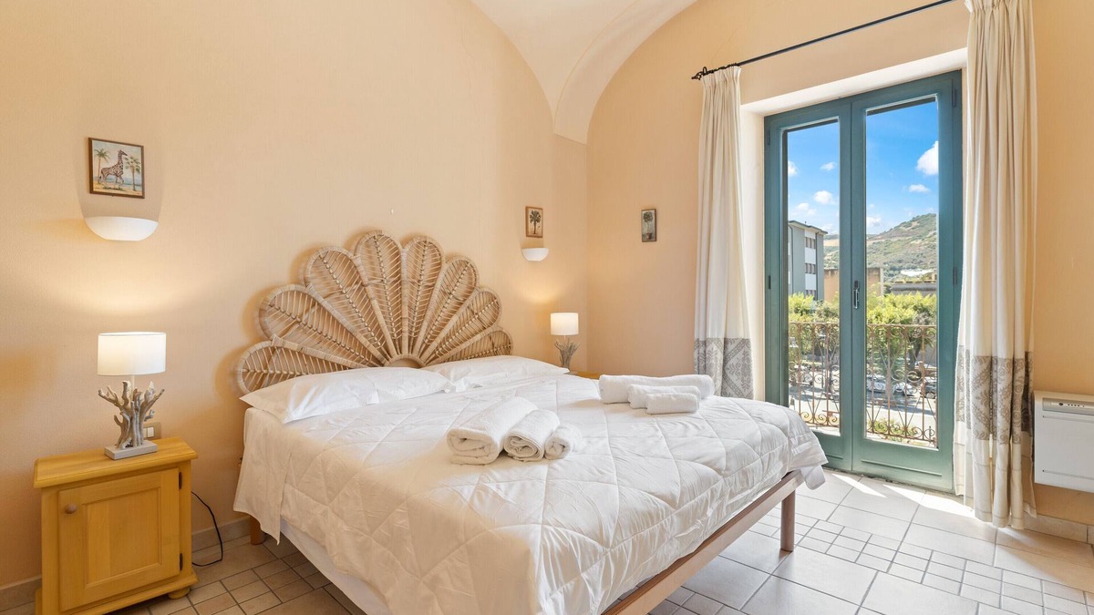 Bosa Historic Centre Apartment | Apartment 'Color Sabbia' with Balcony, Wi-Fi and Air Conditioning
