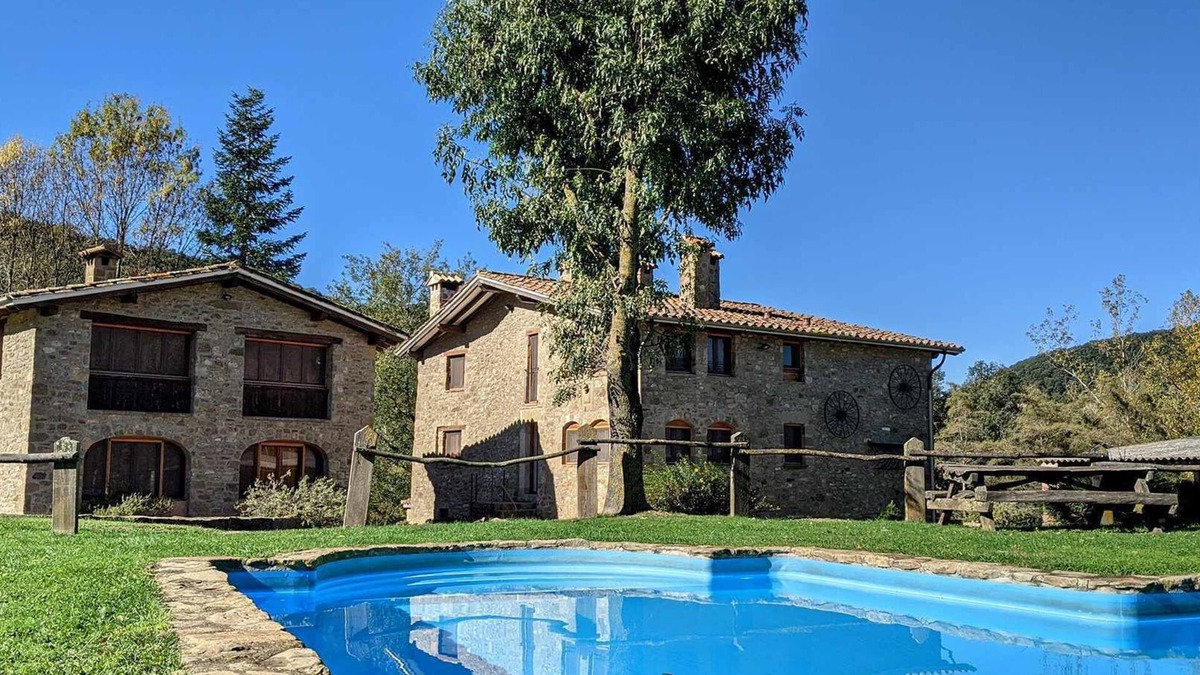 Santa Pau Apartment | Apartment 'Mas El Carrer - Blanc' with Shared Pool, Shared Garden and Wi-Fi