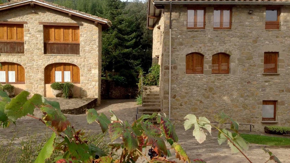 Santa Pau Apartment | Apartment 'Mas El Carrer - Blau' with Shared Pool, Shared Garden and Wi-Fi