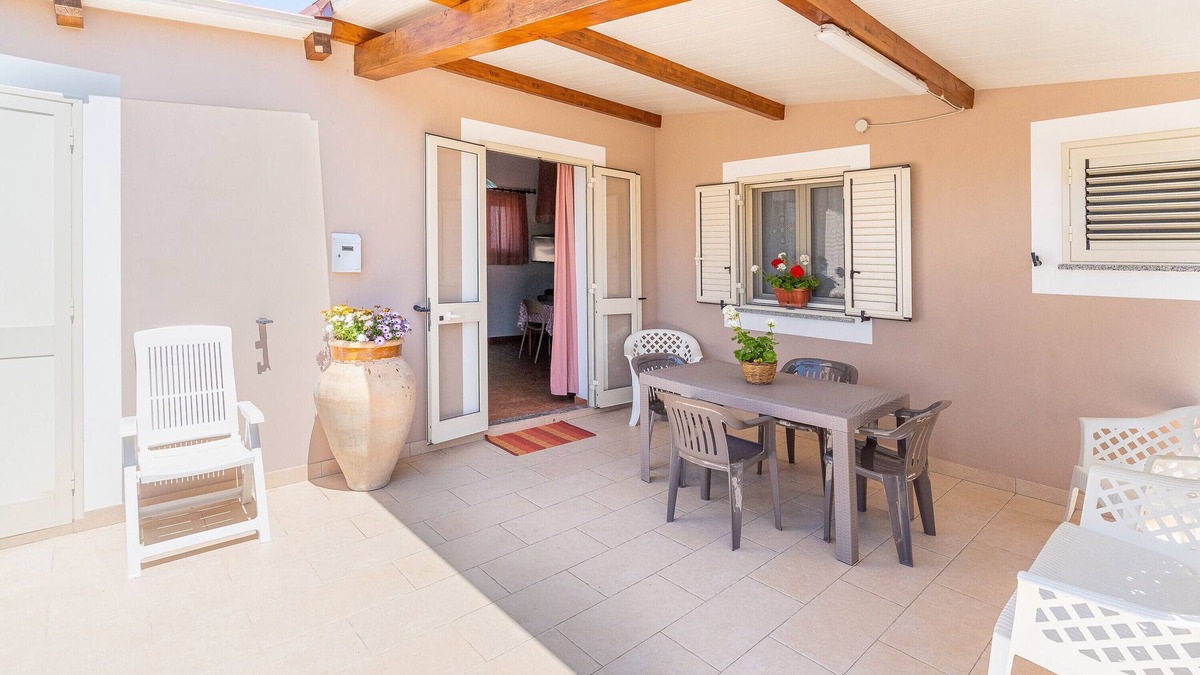 Granelli Apartment | Apartment 'Nonna Rosa' with Private Terrace, Shared Garden and Air Conditioning