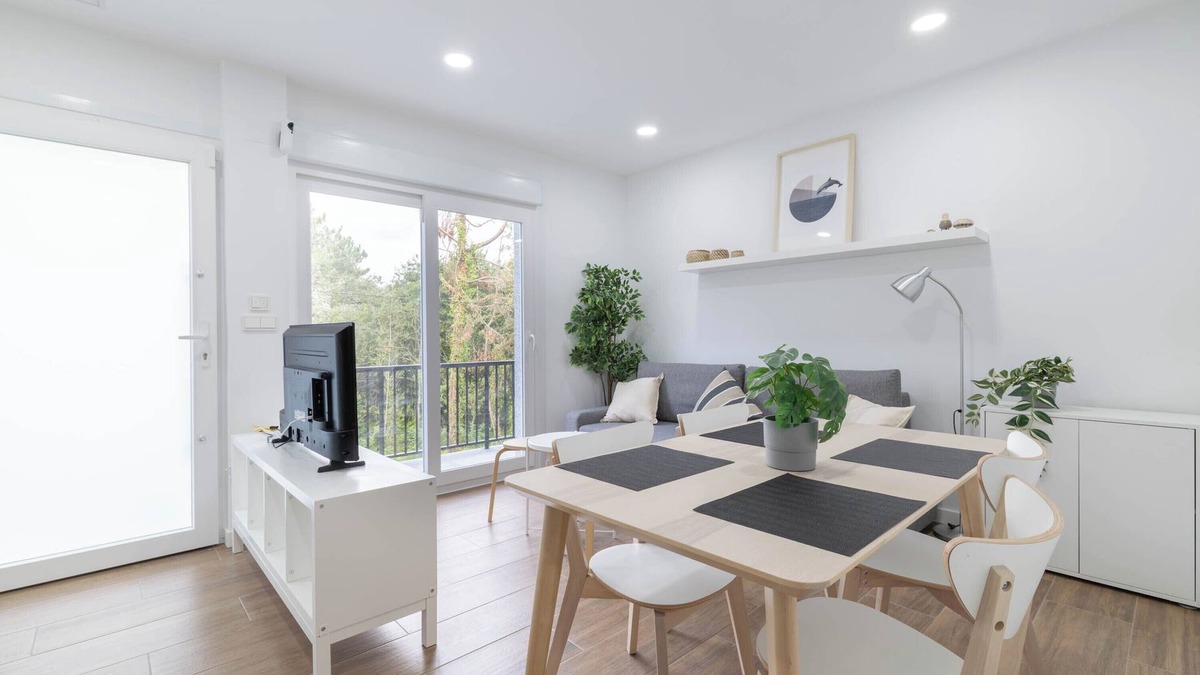 Rates Apartment | Apartment 'Ría De San Cosme Laxeira' with Mountain View, Shared Garden and Air Conditioning