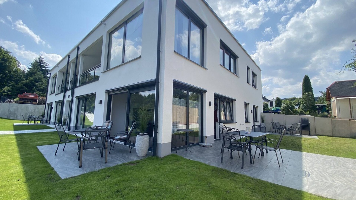 Saaldorf Condo | Apartments-Saaldorf WG1 with terrace and view of the reservoir