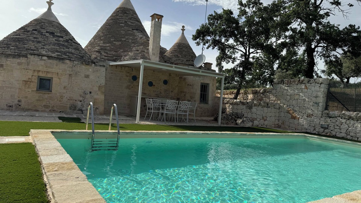 Martina Franca Villa | Aprus trullo surrounded by greenery with private pool.