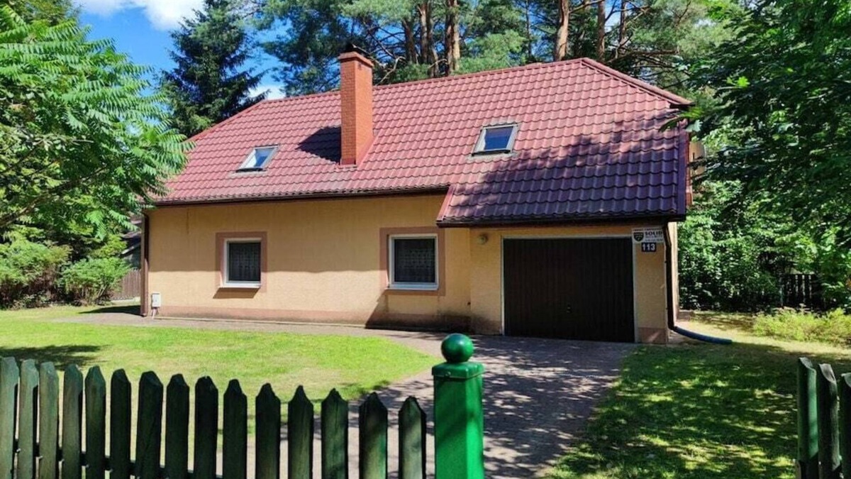 Spychowo House | at the lake with a boat